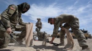 Soldiers of the North Carolina National Guard’s 30th Armored Brigade Combat Team (ABCT) prepare to roll out to their exercise area against OPFOR